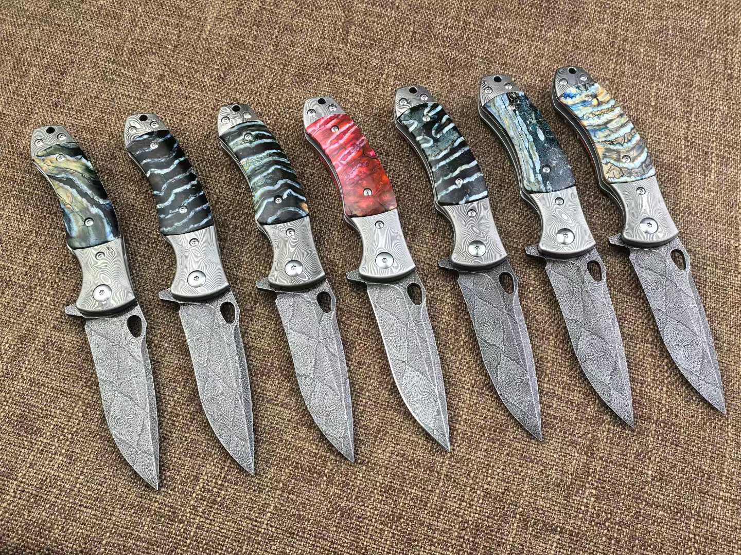 Swedish Steel Forged with Sakura pattern Handle Combination Made from Hardened and Finely Ground Mammoth Teeth from Approximately 5000 Years Ago Hand-Stitched Leather Sheath